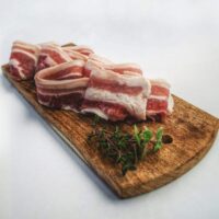 raw bacon on a tray ready to be cooked the microwave