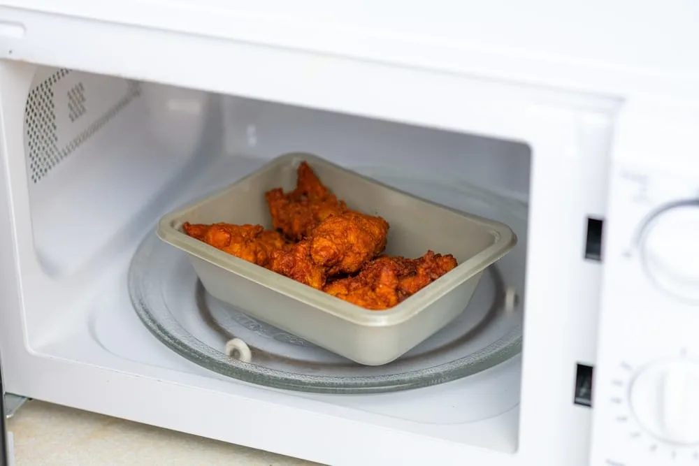 Fried chicken wings in microwave.
