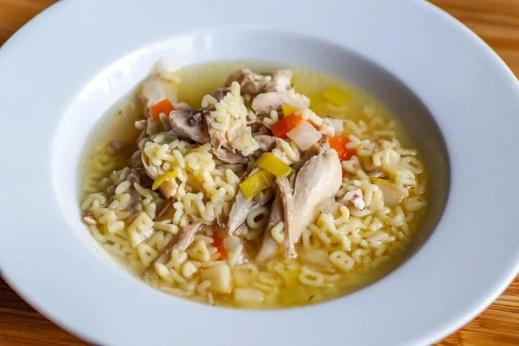 Reheat chicken soup in microwave.