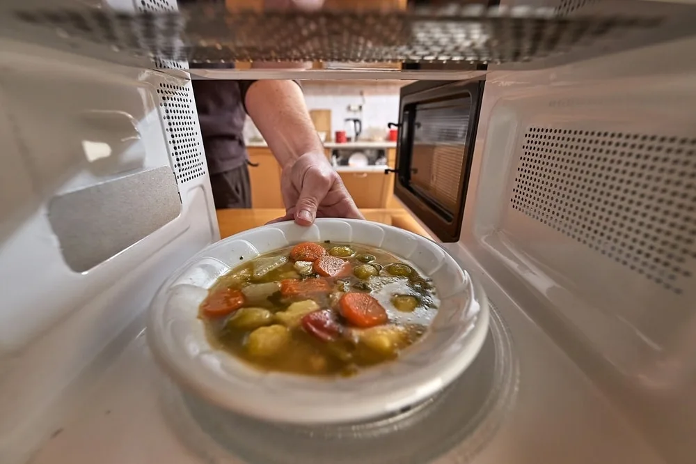 Chicken soup in microwave.
