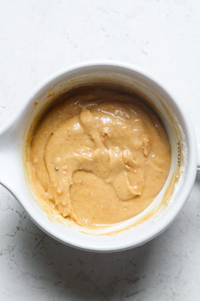 Peanut butter in white bowl.