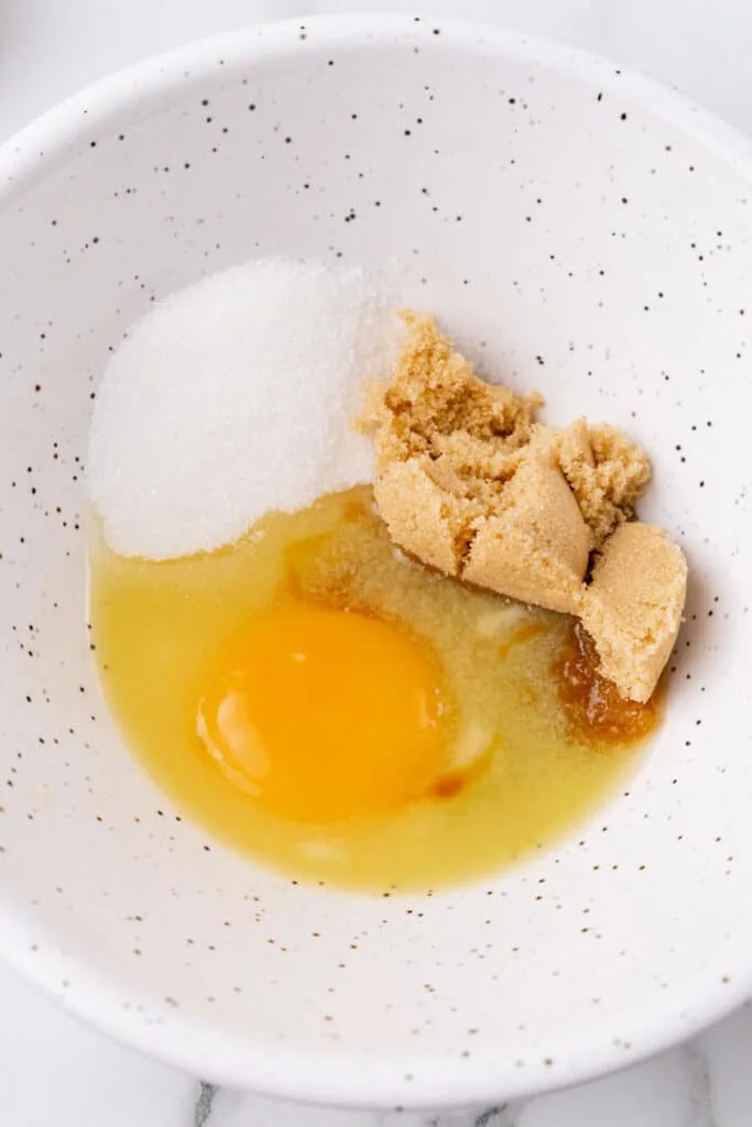 Egg with brown sugar and white sugar.