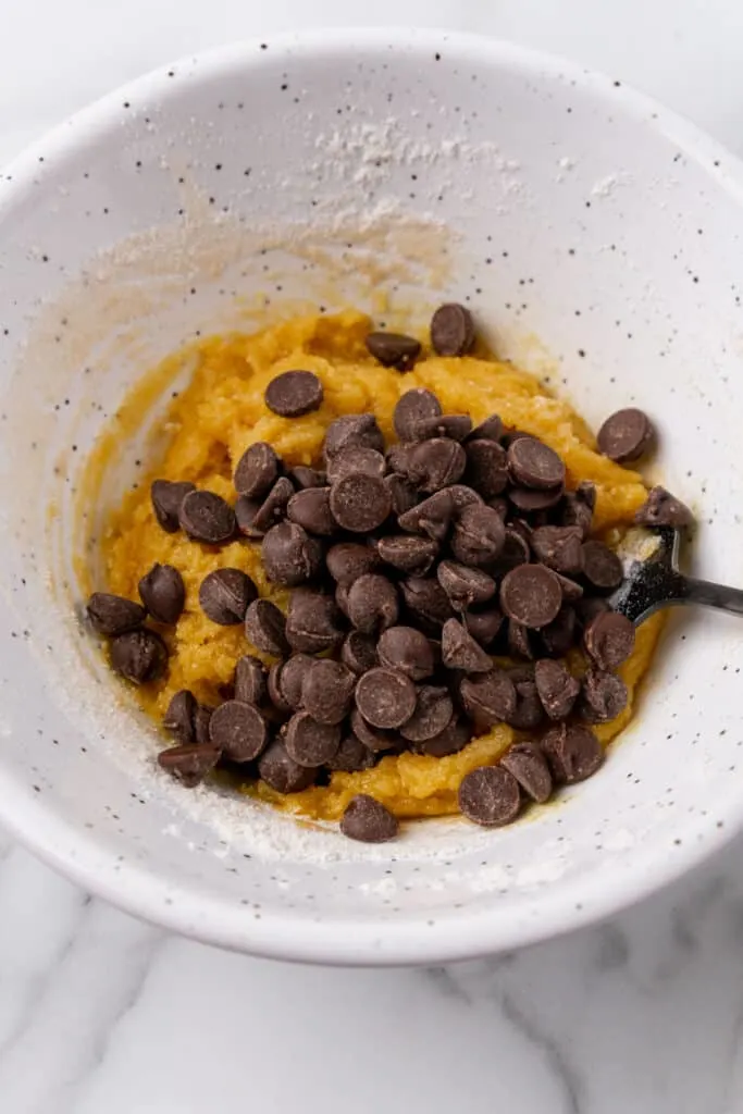 Chocolate chip cookie dough in bowl.