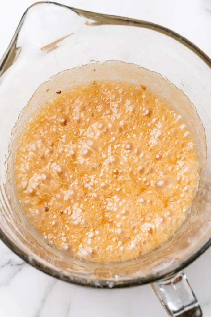 Bubbly brittle mixture in bowl.