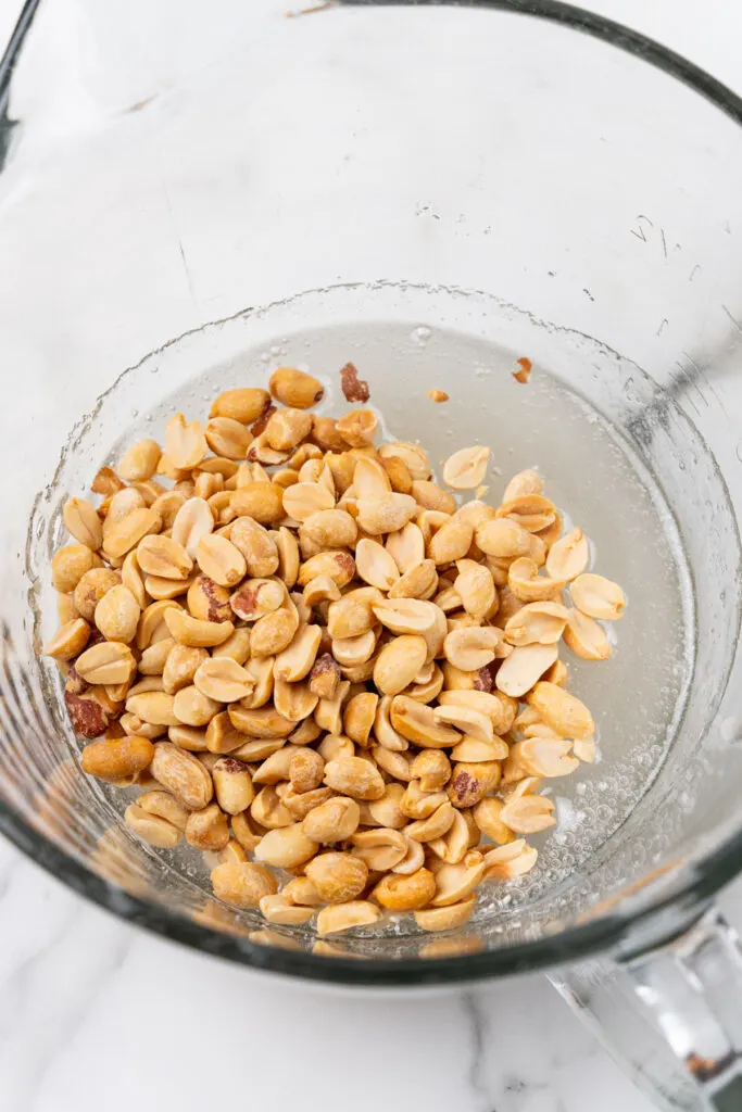 Peanuts and liquid in bowl.