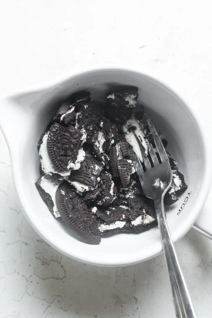 Crushed Oreos in bowl.